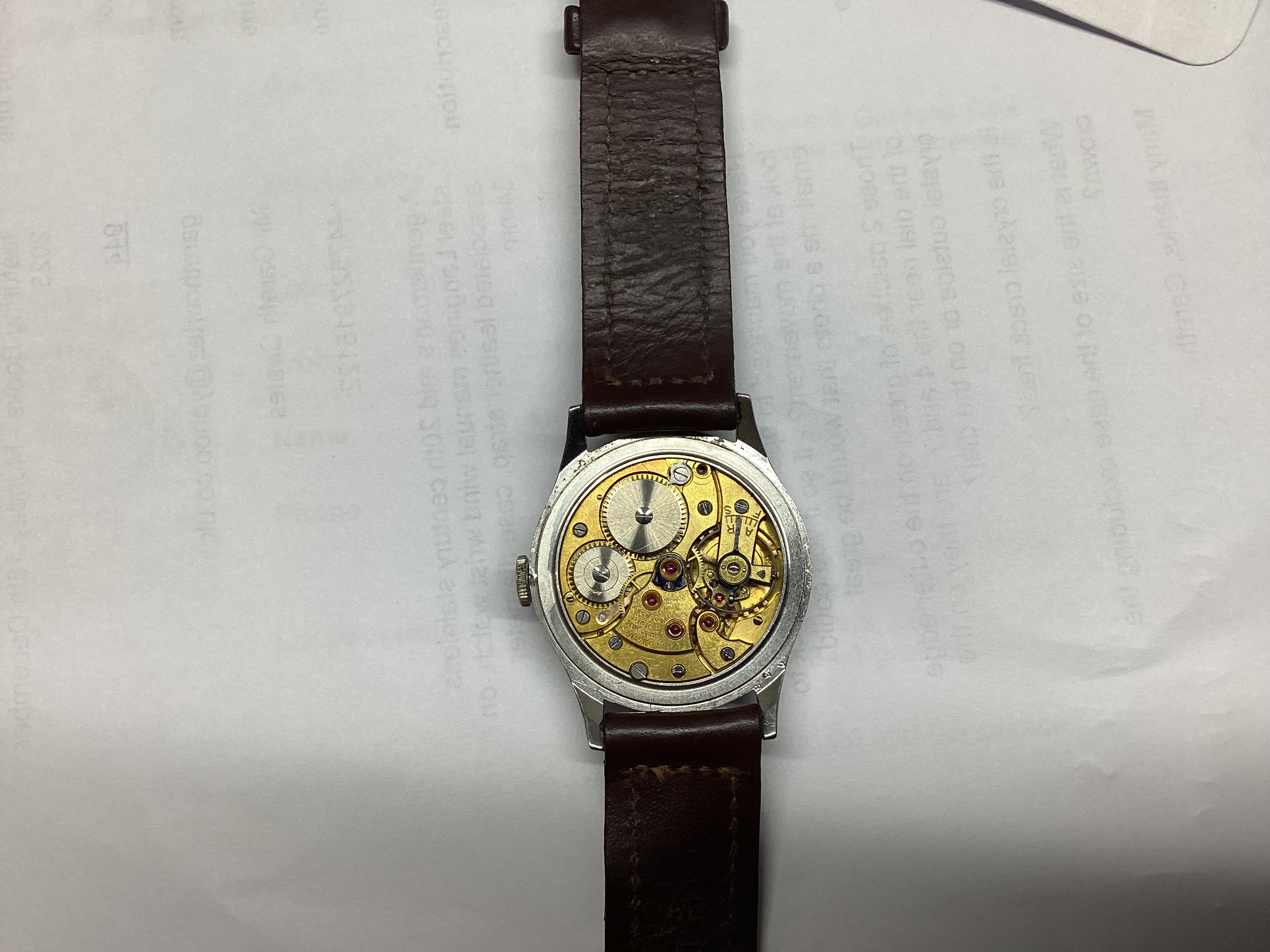 A gentleman's mid 20th century stainless steel Longines manual wind wrist watch, on associated leather strap, case diameter 34mm.